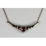 A 9ct gold synthetic ruby and diamond pendant necklace.