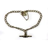 A 9ct yellow gold bracelet, padlock and claddagh charm.