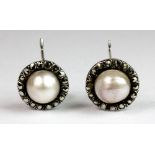 A pair of vintage 925 silver cultured pearl and marcasite earrings.