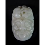 A fine Chinese carved mutton fat jade buckle, probably 19th century, Depth 8cm.
