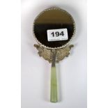 A Chinese porcelain and white metal hand mirror with jade handle, L. 18cm.