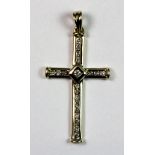 A 9ct gold diamond set cross.