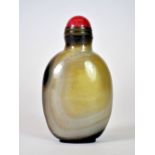 An unusual Chinese banded agate snuff bottle (well hollowed) with gilt and pink hardstone stopper,