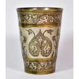 Islamic Interest, a silvered hammered Persian beaker.