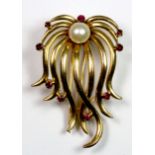 A heavy Arabic hallmarked yellow metal (tested high carat gold) ruby and cultured pearl brooch,