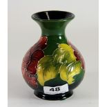 A Moorcroft pottery 'Hibiscus' design globular shaped vase, H. 12.5cm. Excellent condition.