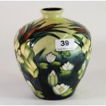 A Moorcroft 'Lamia' pattern vase decorated with bulrushes and waterlilies on a pale yellow ground,