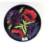 A Moorcroft 'Anemone' pattern plate, c. 1994, Dia. 22 cm, (Boxed). Excellent condition.