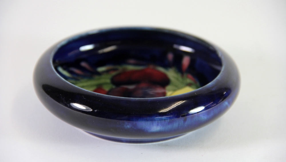 A William Moorcroft pottery 'Wisteria' pattern circular shallow rimmed dish, with impressed - Image 2 of 3