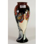 A Moorcroft pottery 'Tulip' design tall vase, H. 28cm. Excellent condition.