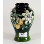 A Moorcroft 'Passion Fruit' design vase by Rachel Bishop, dated 1997, H. 17cm. Excellent condition.