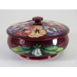 A Moorcroft pottery 'Pansy' design powder bowl and cover, dated 5/3/94, Dia. 13.5 cm H. 8cm.