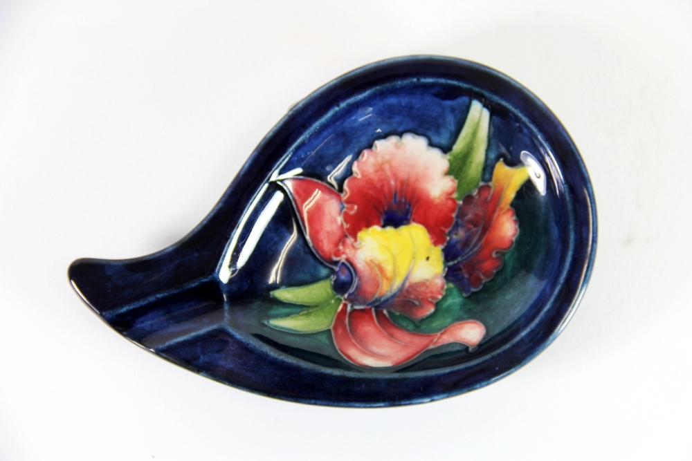 An early Moorcroft 'Orchid' design ashtray with the original Moorcroft label to base, W. 15cm x D.