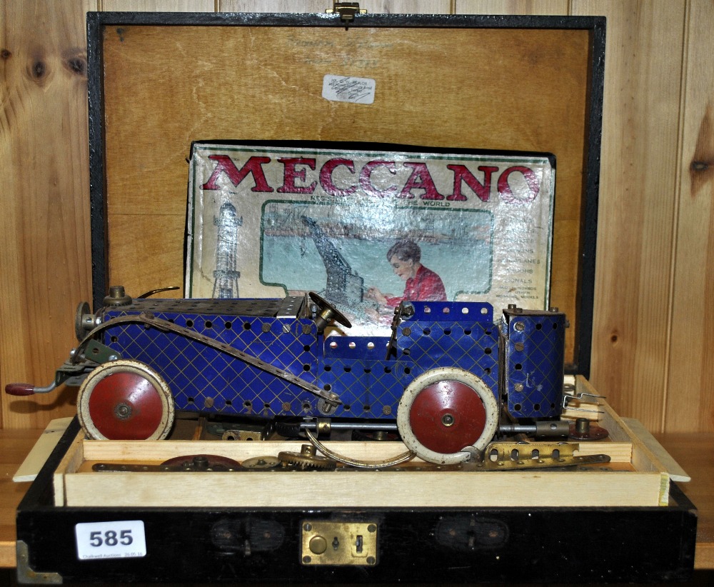 A vintage Meccano set including a racing car.