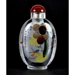 An inside painted and signed lead crystal snuff bottle depicting scenes of lotus flowers and