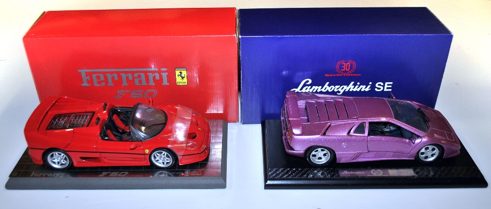 A boxed die cast Lamborghini model and a Ferrari F50 model.