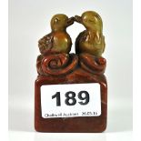 A mid 20th century Chinese mixed colour carved hardstone seal mounted with a pair of Mandarin ducks,