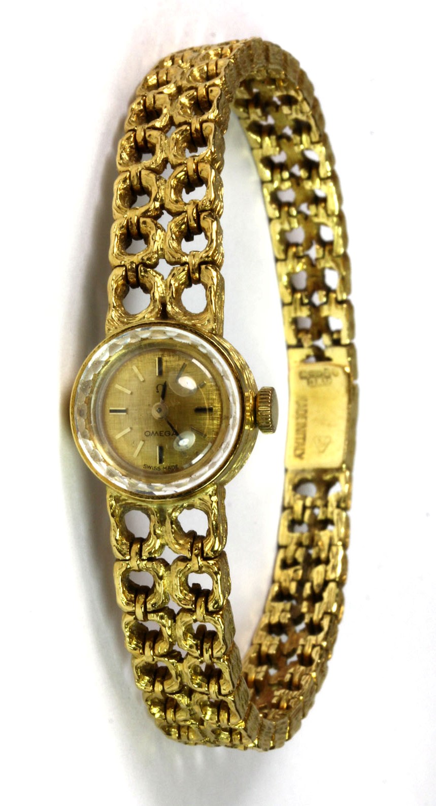 An 18ct lady's 1960's Omega wrist watch with integral strap and original box.