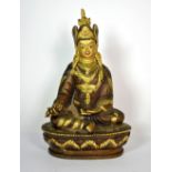 A finely decorated Tibetan bronze figure of a seated Songtsen Gambo, H. 20cm. Est. £300 - 400