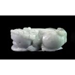 A mixed colour Chinese carved jade lion dog amulet, L. 5cm.