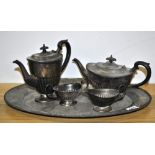 A silver plated four piece tea set and tray.