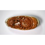 A mixed colour Chinese carved pebble hardstone amulet, L. 8.5cm.