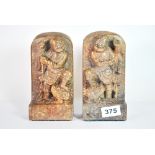 A pair of Chinese carved soapstone bookends, H. 18cm.