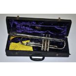 A cased silver plated trumpet.