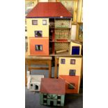 A large vintage wooden dolls house, W. 104cm, H. 100cm, together with two further cottage dolls