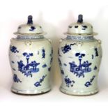 A pair of 19th century Chinese hand painted porcelain storage jars and lids, H. 46cm.