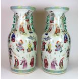 A pair of unusual 19th/early 20th century hand enamelled porcelain vases featuring numerous