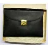 An Italian leather attache style bag with original box.
