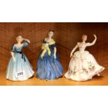 Three Royal Doulton lady figures "Celeste" HN2237, "Andrienne" HN2304 and "Shirley" HN2702.