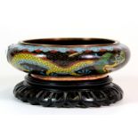 A similar smaller Chinese cloisonné on bronze bowl on hardwood stand, Dia. 14cm, H. 6cm.