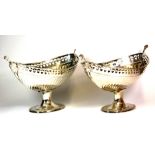 A pair of large silver plated fruit baskets, H. 26cm, W. 44cm, (1 A/F to handle)
