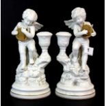A pair of Amorini De Pompeii white bisque porcelain cherub figures, H. 23cm.