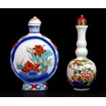 Two Chinese hand painted porcelain snuff bottles, H. 9cm.