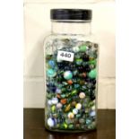 Large old glass sweet jar of marbles