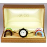 Gucci lady's bangle wristwatch with multiple bezels in original leather box.