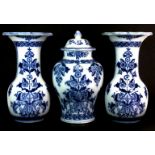 A set of three Dutch 19th century porcelain fireplace garnitures by Petrus Regout & Co with