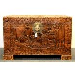 An ornately carved early 20th century Chinese camphor wood chest, 83 x 50 x 53cm.