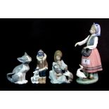 Four Lladro figures.