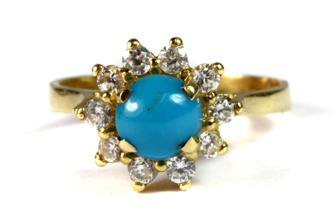 A yellow metal (tested 18ct gold and with an arabic hallmark) stone set cluster ring (P).