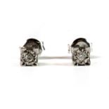 A pair of 9ct white gold diamond stud earrings.