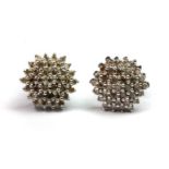 A pair of 9ct white gold (stamped 9K) diamond cluster earrings (approx. 1ct diamonds).