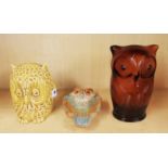 A Sylvac owl money box; impressed 1506 to base, an amber glass owl money box and a pottery owl