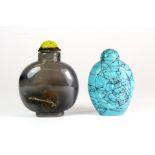 A unusual Chinese grey agate snuff bottle and a carved turquoise snuff bottle, H 6 & 7cm, Prov.