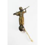 An early 20th century Austrian cold painted bronze hanging bell button figure of an Arab with a gun,