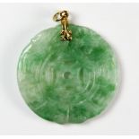 A Chinese carved lucky cash jadeite pendant, Dia. 3.5. Private estate purchased c. 1973.