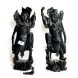A pair of over painted Chinese carved hardwood figures with metal inlay, one A/F to hand, H. 40cm.